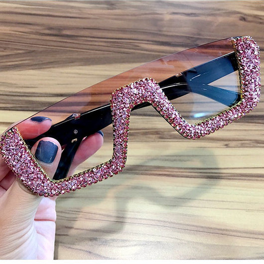 Black square sunglasses with a wavy top frame embellished with brown and clear rhinestones and gradient smoke lenses. - Image 16