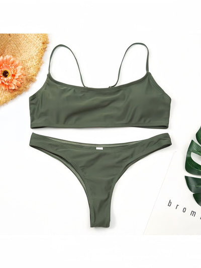 Women's casual orange textured bikini set with scoop neck top and high-cut bottoms against a stone wall. - Image 28