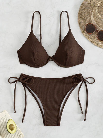 Black ribbed two-piece bikini with an underwire top and tie-side bottoms on a white marble surface. - Image 7