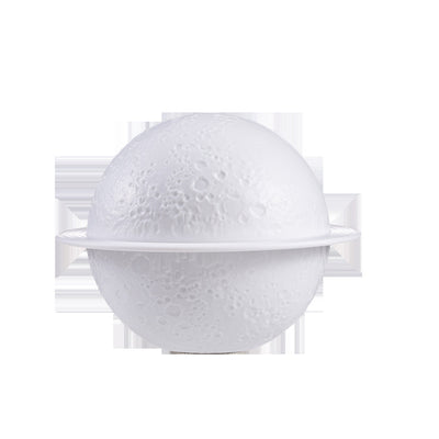 White moon-shaped humidifier with a textured surface resembling craters and a thin ring around its middle. - Image 10