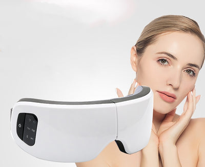 White Bluetooth Smart Eye Massager with vibration, hot compress, and airbag massage, featuring a foldable design. - Image 2