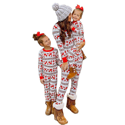 Mother and two daughters in matching red and white reindeer and snowflake print long-sleeve Christmas pajamas. - Image 12