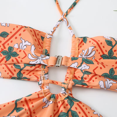 Dark green floral one-piece swimsuit with halter neck, bandeau top, cut-outs, and matching sheer sarong. - Image 9
