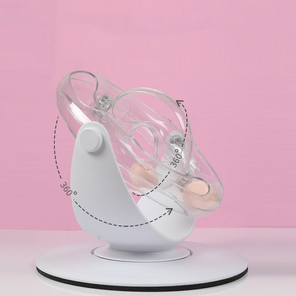 Clear plastic cat turntable toy with two pink balls inside, designed for interactive play and entertainment.