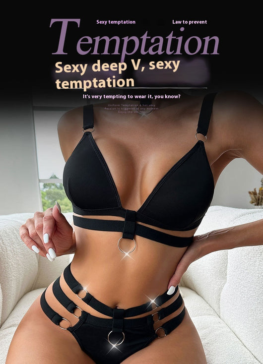 Woman wearing a royal blue strappy lingerie set with O-rings, including a bra, high-waisted bottoms, and a choker. - Image 9