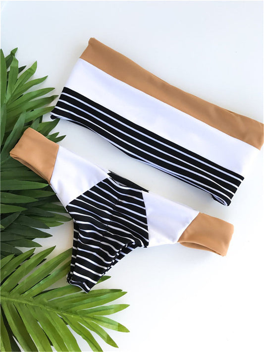 Striped printed split triangle female swimsuit with bandeau top and color block bottom on white background.