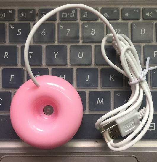 Bright blue donut-shaped mini portable USB air humidifier purifier with a white central filter and silver button. - Image 7
