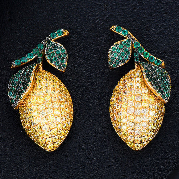 Aretes de Circonita Forma Mango en Oro Cepillado