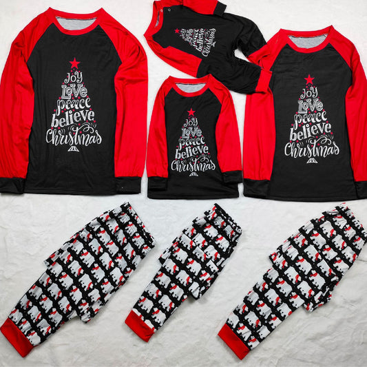 Family matching Christmas pajamas with black tops, red raglan sleeves, 'Joy Love Peace Believe Christmas' graphic, and polar bear print pants.