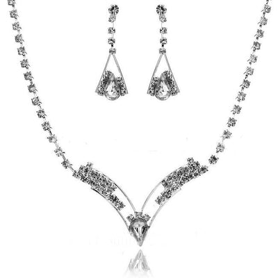 Silver-tone bridal jewelry set with a crystal necklace featuring a V-shaped pendant and matching crystal drop earrings. - Image 3