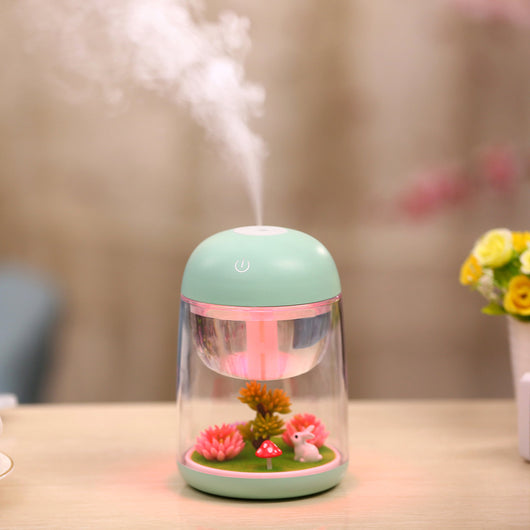 Pink and clear columnar humidifier with a micro landscape inside, featuring a white rabbit, red mushroom, and artificial plants. - Image 4