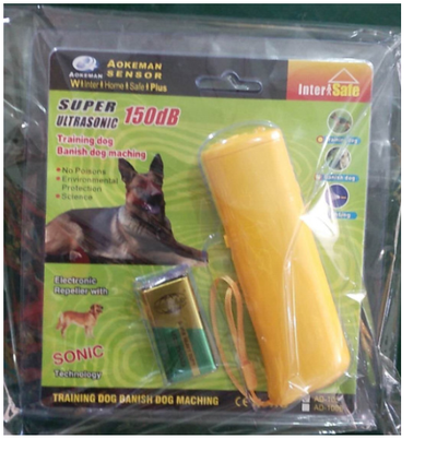 Yellow and black ultrasonic dog training devices with wrist straps, one in retail packaging. - Image 21