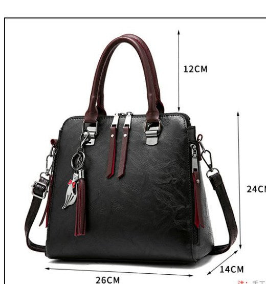 Bolso Elegante de Cuero con Dije de Gato y Borla - Image 3