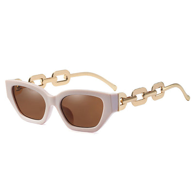 Red cat-eye sunglasses with dark lenses and gold-colored chain link temples on a white background. - Image 5