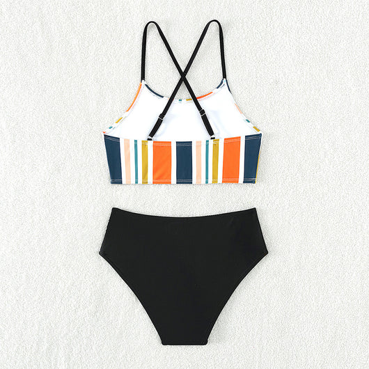 Girls' two-piece bikini swimsuit with a colorful striped crop top and solid black high-waisted ruched bottoms. - Image 2
