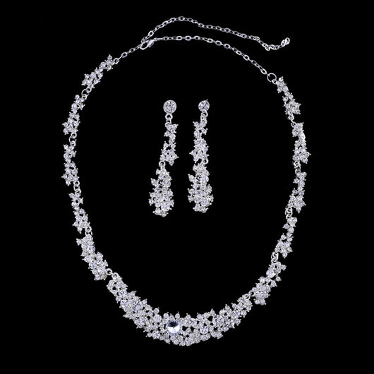 Silver-toned rhinestone necklace and matching dangle earrings set, featuring a sparkling floral cluster design.