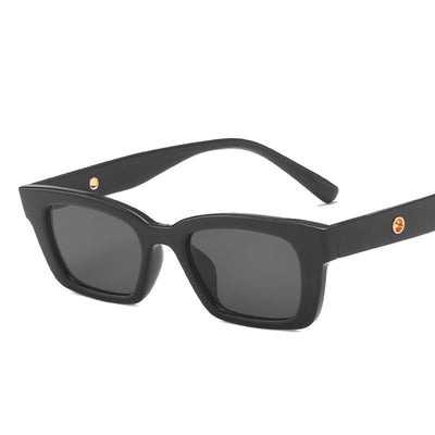 Transparent gray frame sunglasses with dark gray rectangular lenses and small gold accents on the temples. - Image 22