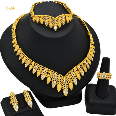 Women's Saudi bridal four-piece gold-colored jewelry set with floral and leaf designs, featuring a necklace, bracelet, earrings, and ring. - Image 6
