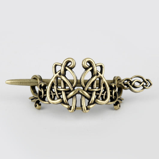 Silver metal hair clip with a retro dragon head and infinity knot design, secured by a plug-in hairpin. - Image 13