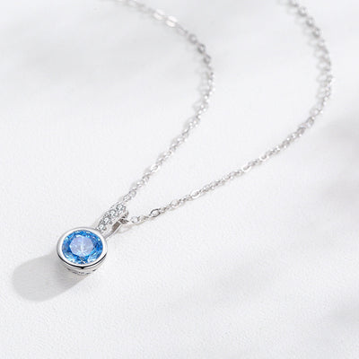 Women's light luxury jewelry set with a silver-toned necklace and hoop earrings, each featuring a sea blue artificial diamond pendant and clear artificial diamo - Image 2