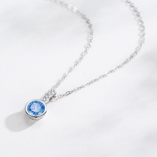 Women's light luxury jewelry set with a silver-toned necklace and hoop earrings, each featuring a sea blue artificial diamond pendant and clear artificial diamo - Image 2