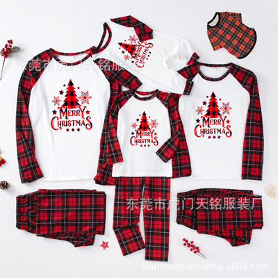 Family of four wearing matching green plaid Christmas pajamas with "Merry Christmas" and Christmas tree print. - Image 10