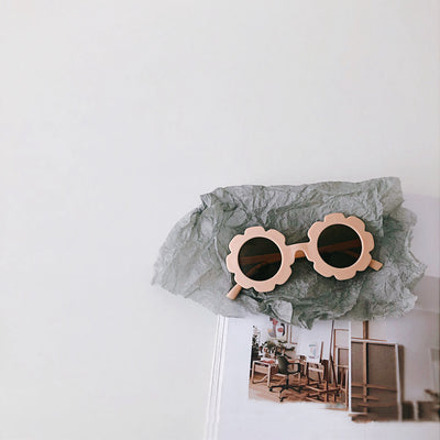 Orange flower-shaped sunglasses for babies and toddlers with dark lenses and a plastic frame. - Image 14