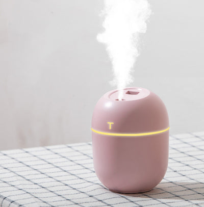 White egg-shaped mini USB humidifier with a 220ml capacity, featuring a subtle 'T' logo and grey accent line. - Image 3