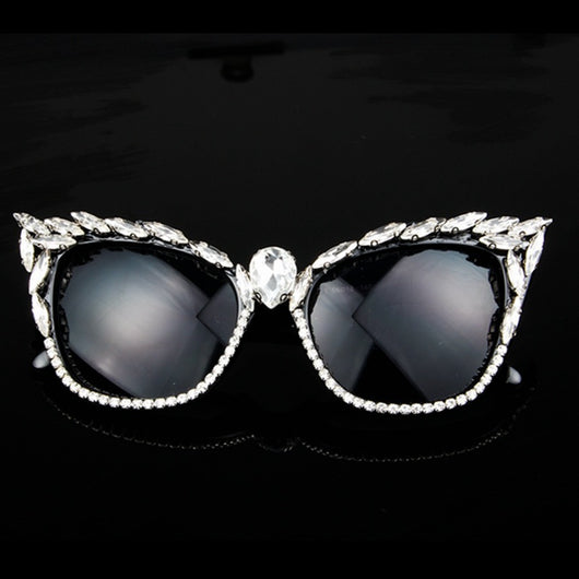 Black cat-eye sunglasses with clear rhinestones along the frames and a large teardrop rhinestone at the bridge.