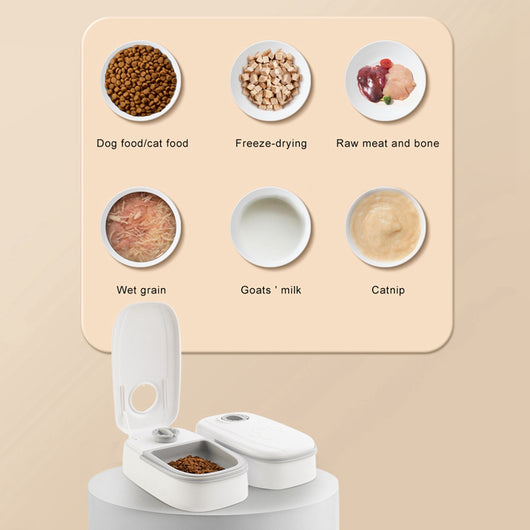 White automatic pet feeder with a pink timer dial and an embossed paw print on the lid. - Image 2