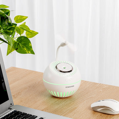 Dark green spherical humidifier with a textured top, control icons, and "HUMIDIFIER" printed on its side. - Image 6