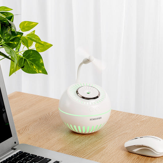 Dark green spherical humidifier with a textured top, control icons, and "HUMIDIFIER" printed on its side. - Image 6