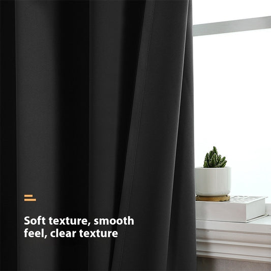Pair of beige blackout curtains with grommet tops, made of polyester, hanging on a silver rod. - Image 2