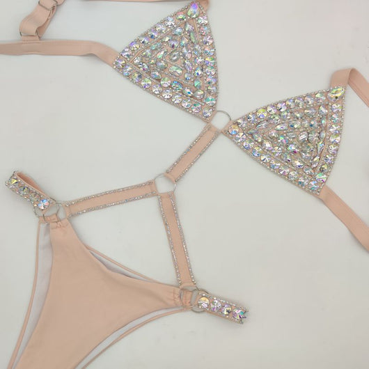 White rhinestone bikini with triangle tops, high-cut bottoms, and silver-toned O-rings and chains. - Image 6