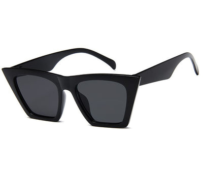 Transparent nude cat-eye sunglasses with brown gradient lenses, featuring a vintage 90s fashion style for women. - Image 2