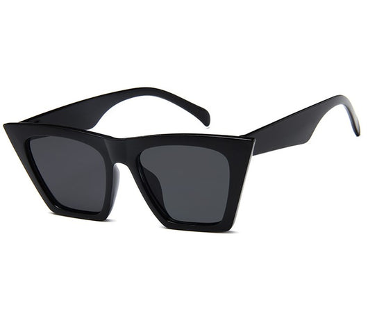Transparent nude cat-eye sunglasses with brown gradient lenses, featuring a vintage 90s fashion style for women. - Image 2
