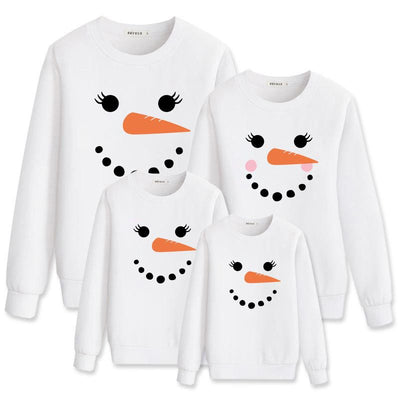 Family matching white long-sleeve crew neck tops with a cute snowman face print, featuring black eyes, an orange carrot nose, and a dotted smile. One adult top - Image 13