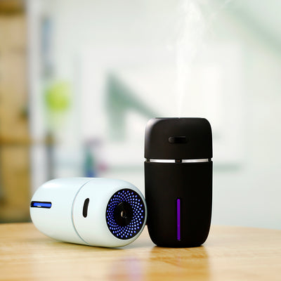 Black portable humidifier with a silver band, a power button, and a water level indicator, suitable for car or home. - Image 5
