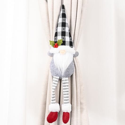 Santa Claus curtain buckle with a black and white buffalo plaid hat, white beard, and red body holding a blue curtain. - Image 12