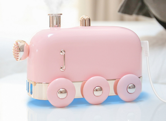 Pink retro mini train ultrasonic humidifier and aroma diffuser with rose gold accents on a white background. - Image 2