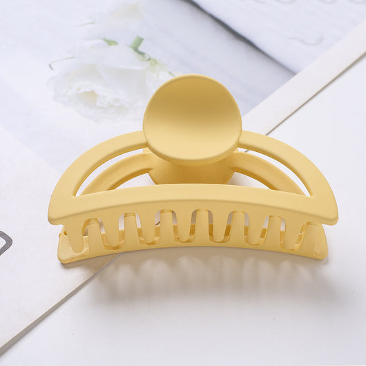 Frosted light blue rectangular hair claw clip with a gold-toned spring mechanism, ideal for securing hair. - Image 4