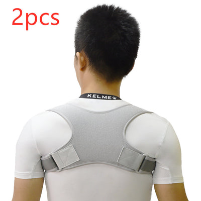 Black back shoulder spine posture corrector worn over a white long-sleeved shirt, showing adjustable straps. (2 pcs) - Image 15
