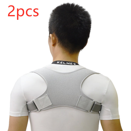 Black back shoulder spine posture corrector worn over a white long-sleeved shirt, showing adjustable straps. (2 pcs) - Image 15