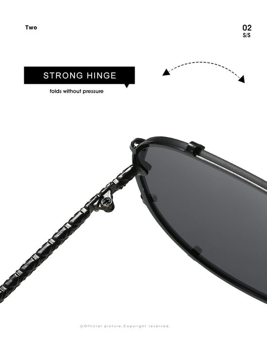 Oversized V-shaped sunglasses with a gold metal frame, white accents, clear lenses, and decorative rivets. - Image 19