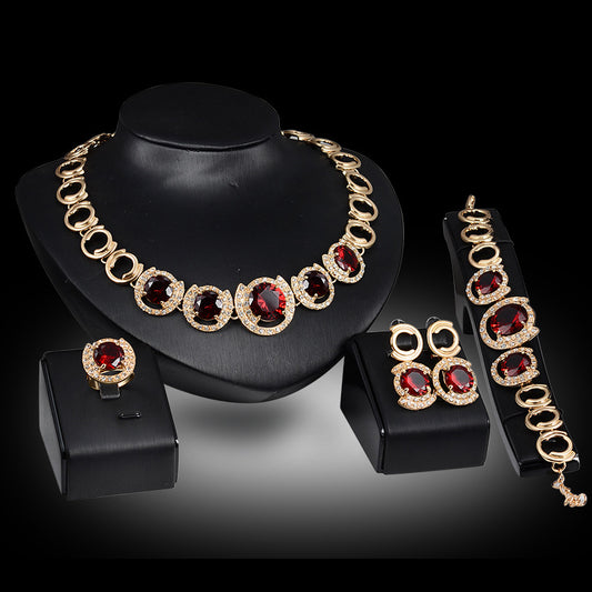 Conjunto de Joyería Nupcial Dorado con Cristales y Circones Verde y Rojo