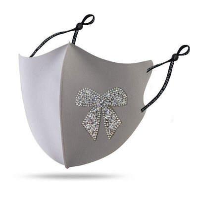 Black cloth face mask with a sparkling red and silver rhinestone bow design and adjustable ear loops. - Image 9