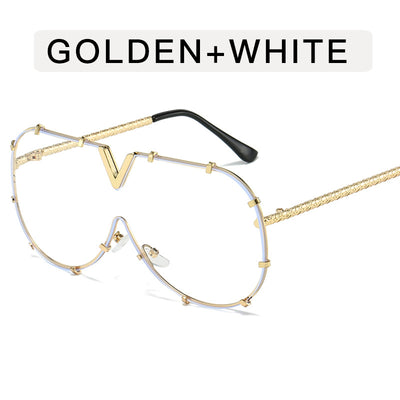 Oversized V-shaped sunglasses with a gold metal frame, white accents, clear lenses, and decorative rivets. - Image 9