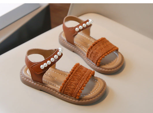 Children's white sandals with pearl ankle straps, woven front strap, and brown sole, featuring a Velcro closure. - Image 9