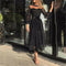 Vestido Negro con Lunares y Mangas de Malla Linterna