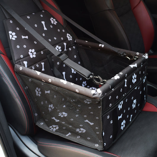 Light grey pet car booster seat with black mesh sides and adjustable straps, installed on a black and red car seat. - Image 6